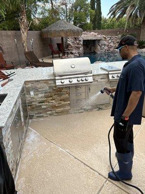 Rinsing the area after cleaning.