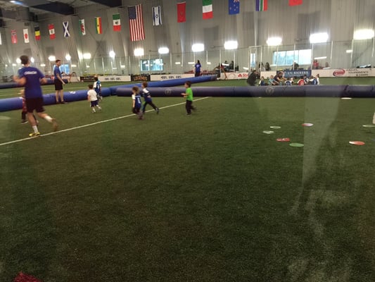 JJ playing with out the parental. Large indoor field.