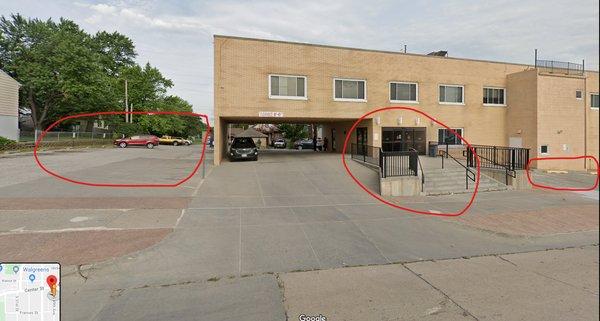 Parking circled to the left and right. Main floor entrance circled in the middle, use the stairs or elevator to go down to the clinic.