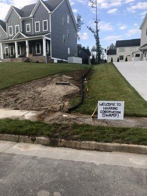 Another Harring Construction homeowner with substandard grading and foundation drainage.