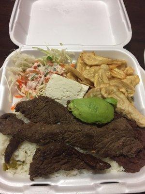 Carne Asada Hondureña( grilled steak, rice, beans, fried green banana slices, salad, avocado and cheese.