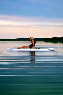 Dominique Garstin Paddle Board Yoga or SUP Yoga strengthens the core while enjoying the stunning Natural Setting of Montauk.