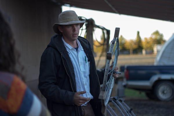 Clay, the Sola Gratia farm manager talking about using old bike parts for farm tools.