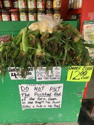 I chuckled when the woman next to me read the signs then put her corn in the bag, pointy end down.