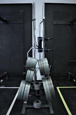 A photo of some of our iron plates on the powerlifting platforms