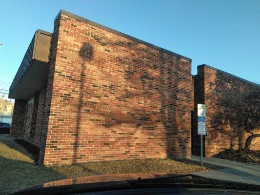 North and West side of the post office.