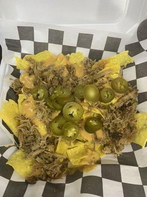 Captain Ron - nachos with our homemade nacho cheese, your choice of meat, jalapeños and our homemade bbq sauce