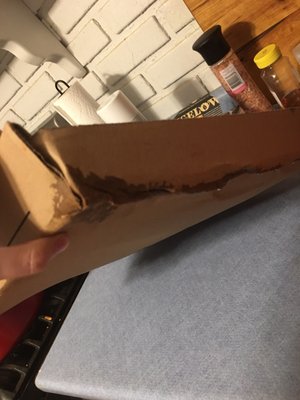 Box falling apart from being saturated in grease