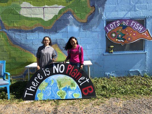 "There is No Planet B" Participants paint Signs for School Strike for Climate at Lots of Fish studio.