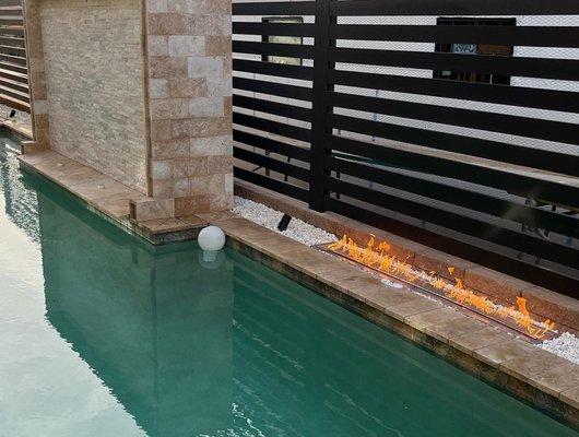 Amazing Water Wall flowing into your Pool. Included with lighting and outdoor fire pits.