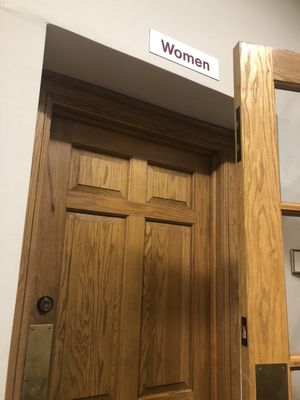 Women's room wood door