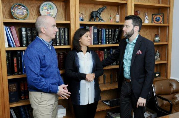 Partners Stephen Fitzgerald, left, and Joshua Goodbaum discuss a case with Associate Elisabeth Lee.