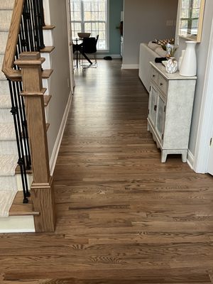 After, adding new wood into front room as well and they feathered it in seamlessly