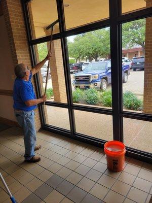 Window cleaning in progress.