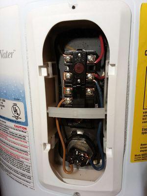 Water heater trouble shooting. Replaced bad relay. Happy customer!