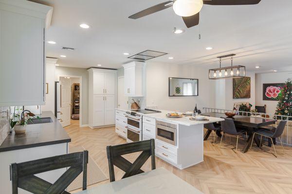 This kitchen was once outdated, small and cramped. With a remodel, it is now open and a much larger living space made for entertaining!