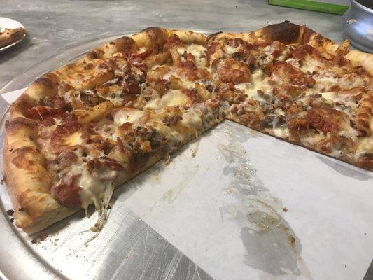 Specialty pizza; fries, pepperoni, steak, chicken, onions & bacon