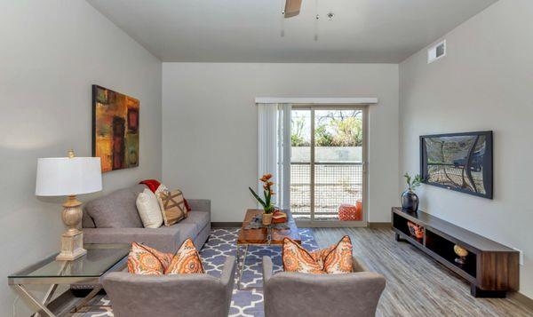 Living Room with Sliding Glass Doors Leading Out to Patio Area