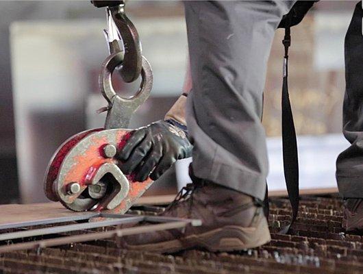 Steel Cities worker handling steel plate