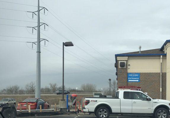 The truck had to pull into the front to get air BUT good news!! The red car was waiting for air, and the hose reached all the way to him!!