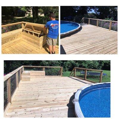 Deck around a pool with built in bench with storage.