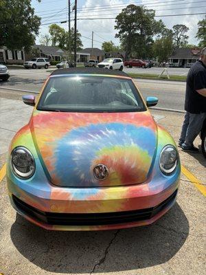 Her funky VW convertible