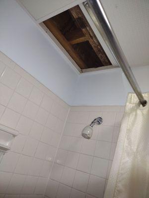 Uncovered ceiling on top off shower