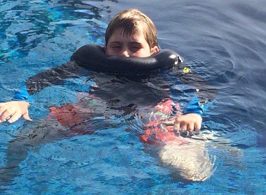 Loves swimming in the pool at the hotel