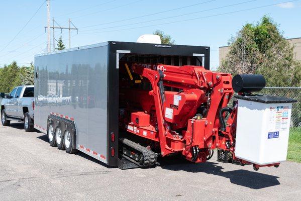 CMC Aerial Lift Loading into No Ramps Enclosure Trailer