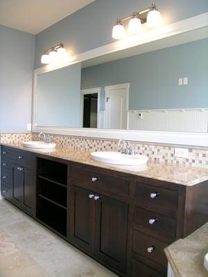 Bathroom with granite countertops and backsplash