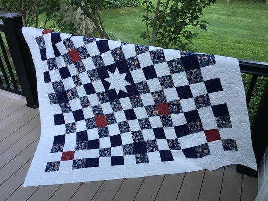 Customer quilt with all over stitched design.