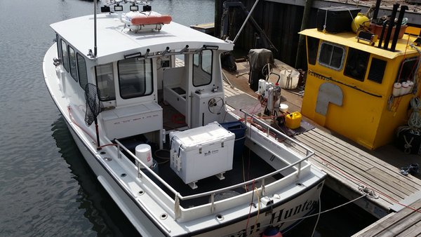 Fuel polishing and tank cleaning done on a boat still in the water.