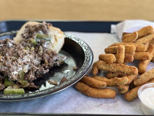 Philly cheesesteak sandwich and fried zucchini