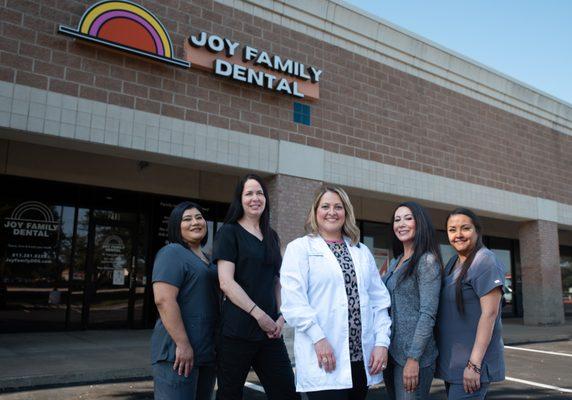 The Joy Family Dental Team outside the practice