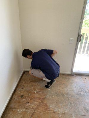 Here we have Blake check the walls with a moisture meter.