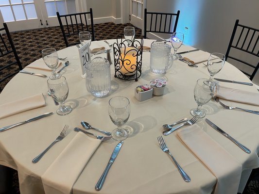 The setup table with a glimpse of the free candle centerpiece thing, available for weddings if you're not bringing your own centerpieces.