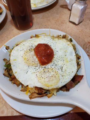 Farmers skillet with eggs over medium