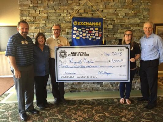 Mike of Local's Choice (left) with Georgia of Wings of Eagles with the Chico Noon Exchange Club giving Wings the Giant Check!