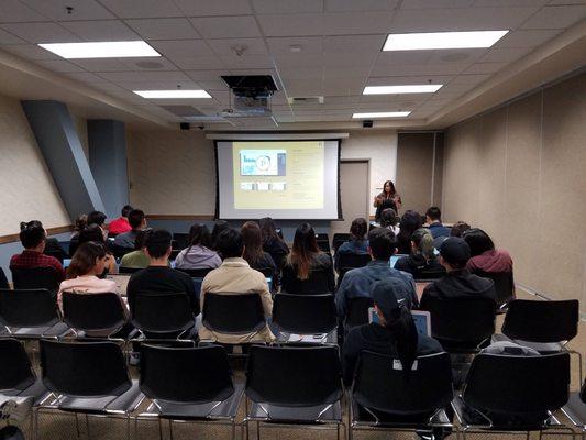 Sylvia giving a presentation at UCI on PowerBI.