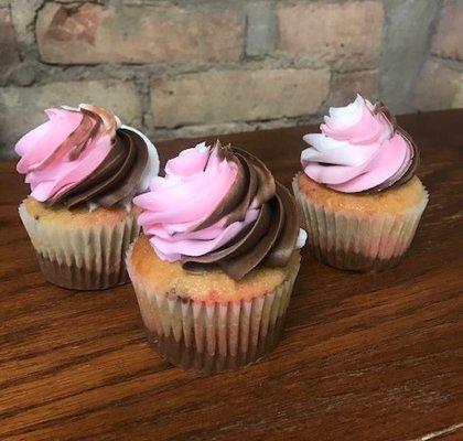 Neapolitan cupcakes with strawberry, chocolate, and vanilla.