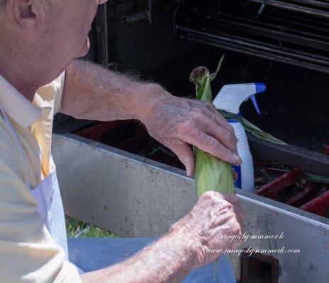 Jerry Butner roasting some 2,000 ears of corn at the Roasted Corn & Baked Potato Booth