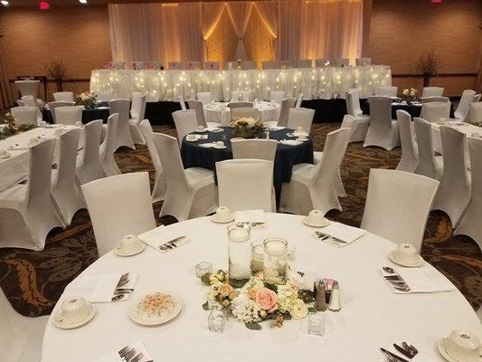 Ivory spandex chair coverings at the Holiday Inn City Center in downtown Sioux Falls.  Call 605-691-9264 to book these covers!