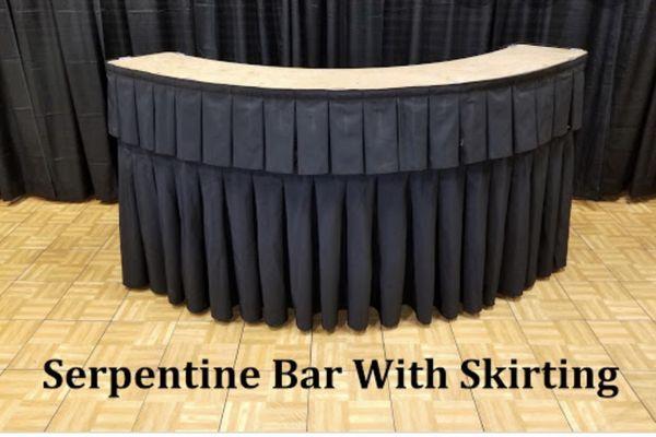 White or black skirt   7 ft serpentine table