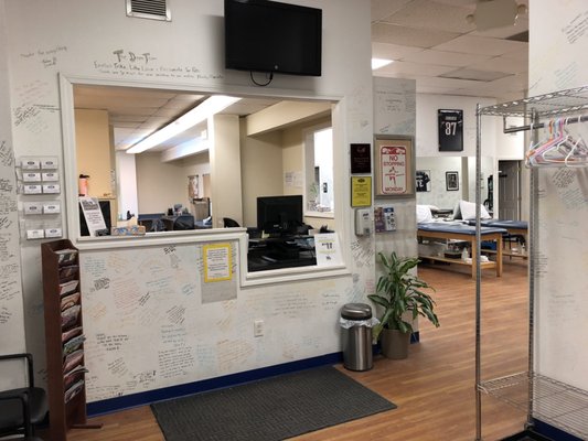 Front desk with patients' notes of gratitude on the walls