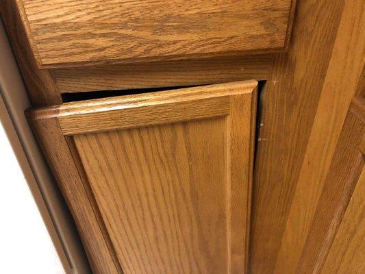 Broken kitchen cabinet doors. We couldn't use several of our cabinets due to the doors being completely broken out when we moved in.