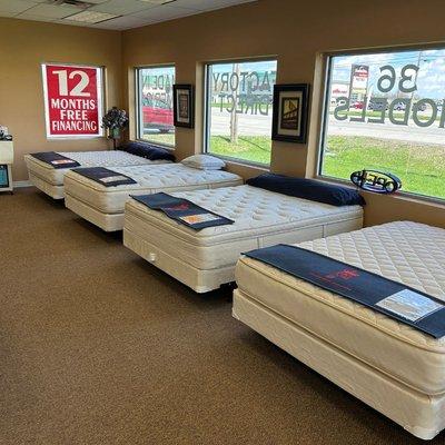 Inside the mattress store with signage for interest free financing