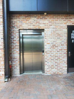 Elevator behind stairs from Center St enterance.  Elevator also located from front enterance on Washington