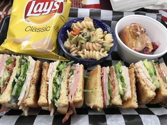 A club sandwich on lightly toasted sourdough, the best damn pasta salad in the world, and a cherry dessert