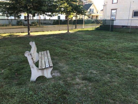 The bench plus the grassy area. Notice the little trees and the fence which enclosed the park.