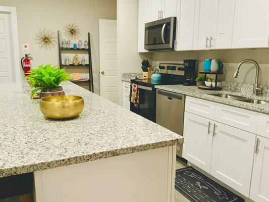 Fully-equipped kitchen with island and bar stools